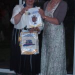 Long Stratton Lions Cub presenting President Angela with a pennant
