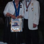 PDG Paul of Bungay Lions presenting President Angela with his personal pennant