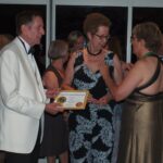 Christine Haines receiving her pin and certificate