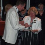 Angela receiving her pin and certificate