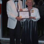 Club President Angela being presented with a certificate