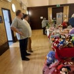 Robyn and Rick admiring the stall at Heybridge Primary School 19th November 2022