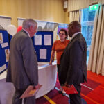 Robyn at her GDPR stand being visited by PID Geoff Leeder and IPIP and Chair LCIF Douglas Alexander