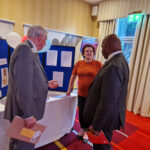 Robyn at her GDPR stand being visited by PID Geoff Leeder and IPIP and Chair LCIF Douglas Alexander
