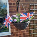 flags in the flower baskets