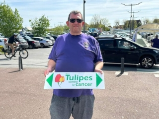 Rick with every tulip is a step against cancer sign