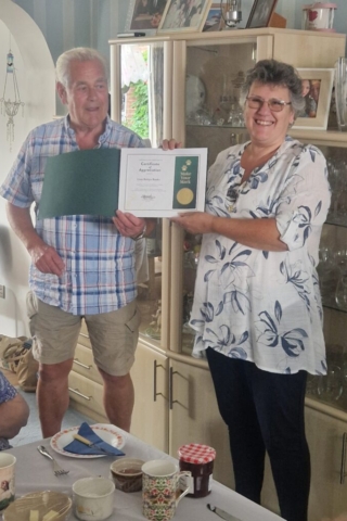DG Colin presenting Robyn with her Certificate of Appreciation from the International President
