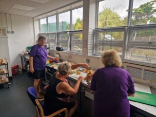 Robyn helping make packed lunch with Leigh Lions