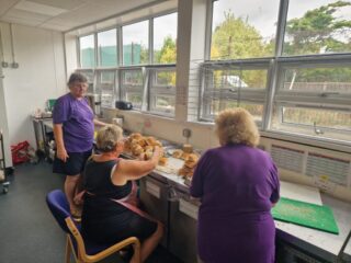 Robyn helping make packed lunch with Leigh Lions