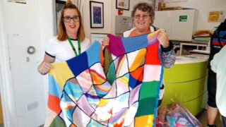 Robyn handing over the blankets to HARP Robyn handing over the blankets to HARP