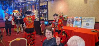 Council Chair Stu Young, LCIF Chairperson IPIP Fabricio Oliviera and the Chinese Dragon Dancers