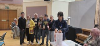 President Louisa with the winning team and their prizes