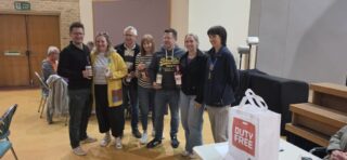 President Louisa with the winning team and their prizes