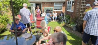 Guests enjoying the sunchine in the garden at the Club Lunch