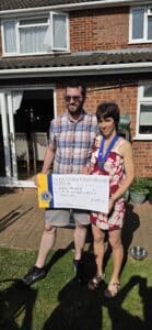 Louisa Presenting Mark from Boys Brigade with a cheque