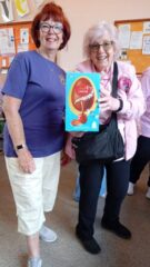 Sandie presenting Sandra from the SWANS with an Easter Egg to say thank you for being our Quiz Master
