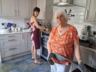President Louisa and Moira in the kitchen